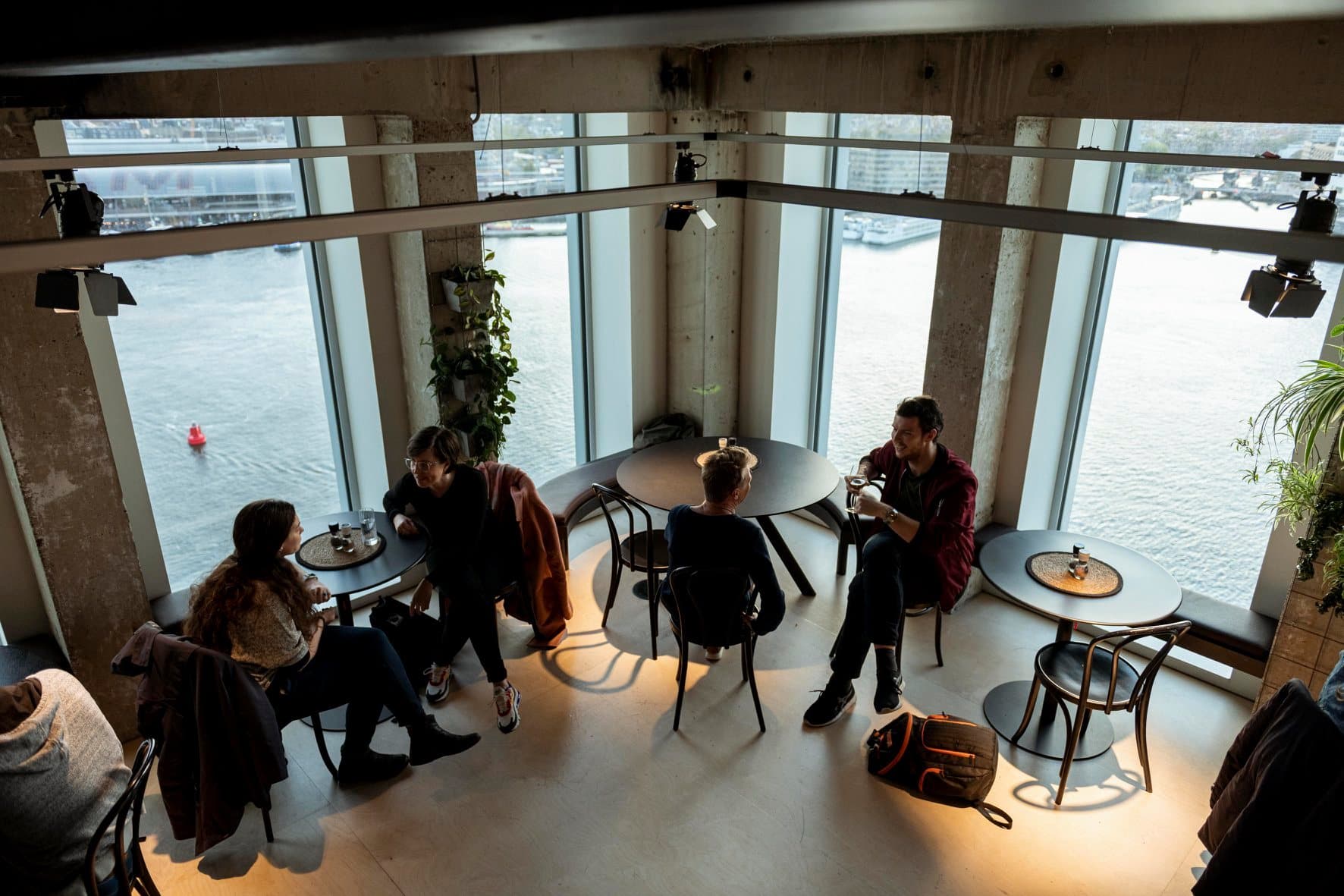 The Swarm community — small group connecting over ideas by the waterfront
